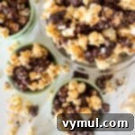 Foolproof Moose Munch Caramel Corn No Corn Syrup No Thermometer 15 Two bowls featuring homemade Moose Munch caramel corn, mixing plain and chocolate-covered pieces for a gourmet treat.
