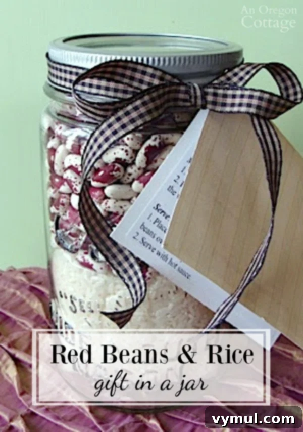 Red Beans and Rice Gift Jar 2 Beautifully layered Red Beans and Rice Gift in a Jar, adorned with a ribbon and a custom gift tag, ready for gifting.