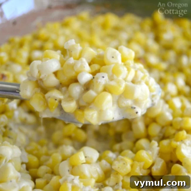 Mastering August: Seasonal Recipes, Expert Tips and Your Printable Planner 5 A spoonful of creamy fresh baked corn, showcasing its rich texture and golden kernels.