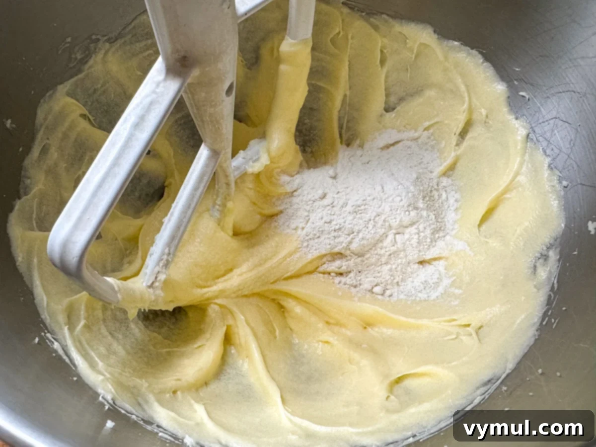 Luscious Lemon Cupcakes with a Sweet Glaze Drizzle 5 mixing batter for lemon cupcakes