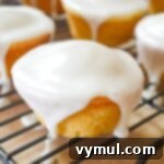 Luscious Lemon Cupcakes with a Sweet Glaze Drizzle 10 glazed lemon cupcake on rack