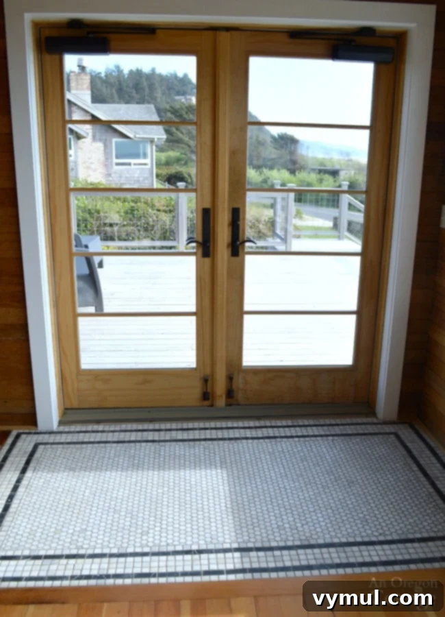 Manzanita Magic: A Reed House Retreat 9 French doors with tile rug at Reed House Manzanita vacation rental