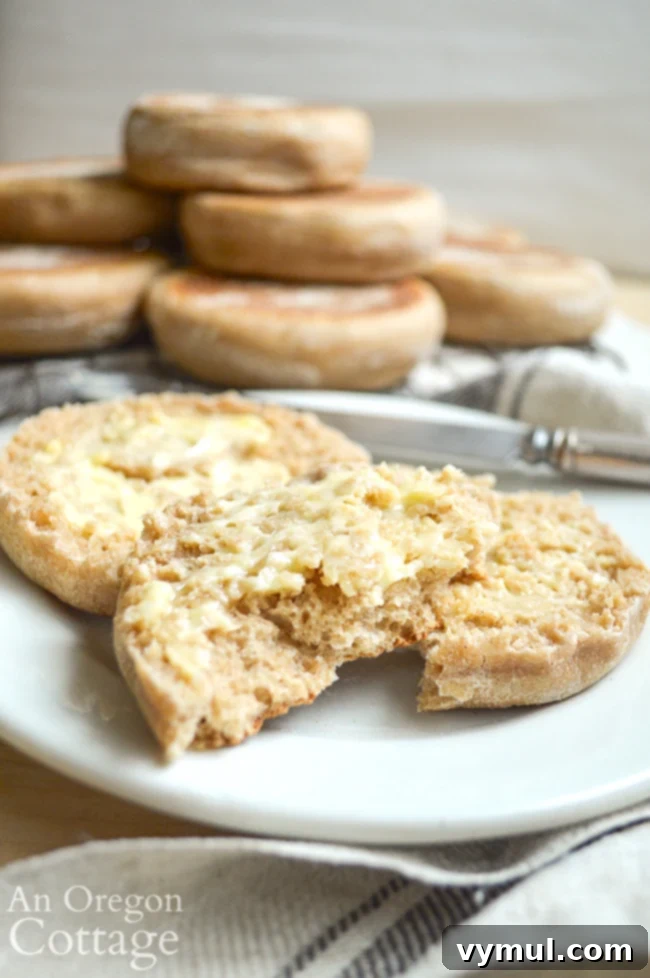 buttered sourdough English muffins on plate