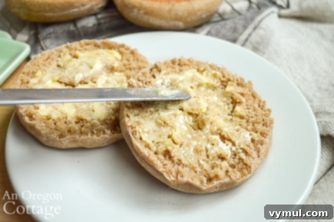 buttering sourdough English muffins