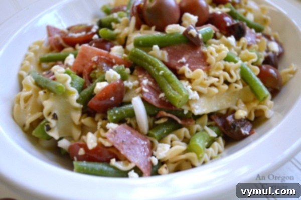 Greek Style Pasta Salad with Green Beans, Tomatoes, Salami and Feta 