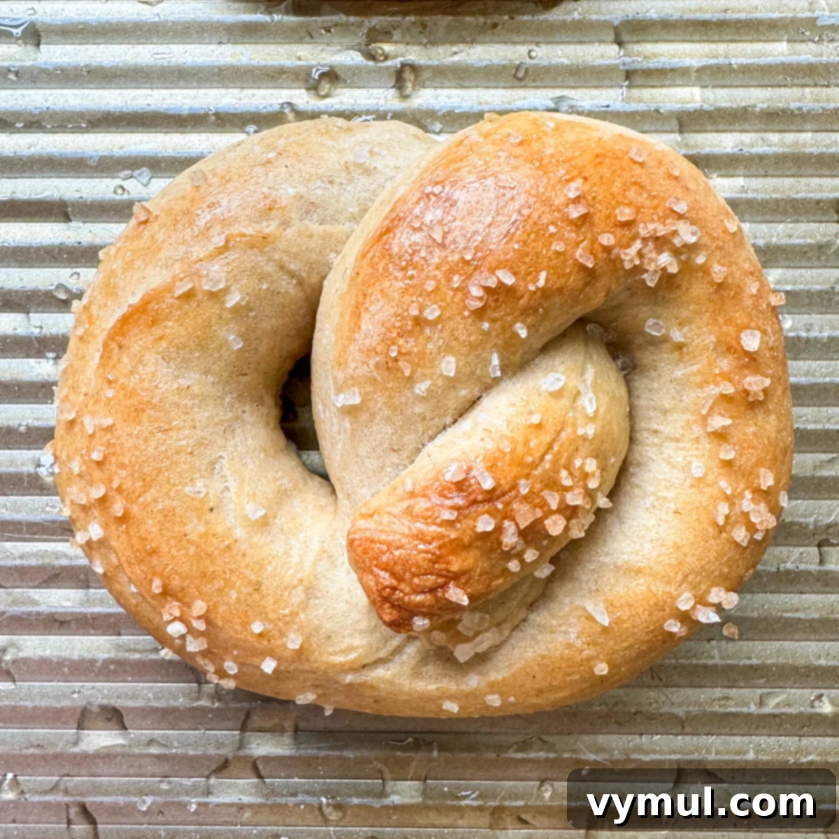 Homemade Soft Pretzels: Quick and Easy in 30 Minutes 3 traditional shaped pretzel cooked on baking sheet close-up
