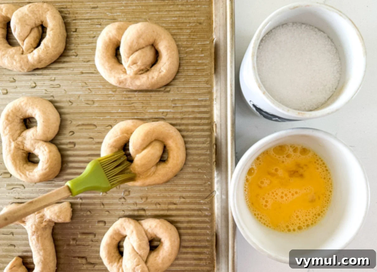 Homemade Soft Pretzels: Quick and Easy in 30 Minutes 7 brushing shaped pretzel dough with egg wash before baking