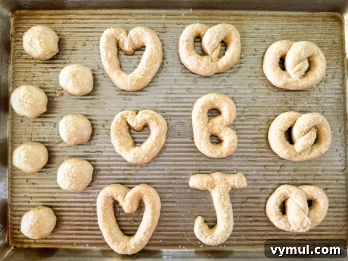 Homemade Soft Pretzels: Quick and Easy in 30 Minutes 8 pretzel dough shaped and topped, ready for the oven