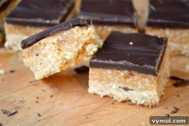 Decadent Caramel Coconut Shortbread Bars 8 Delicious Caramel Coconut Shortbread Cookie Bars on a white plate, ready to be served