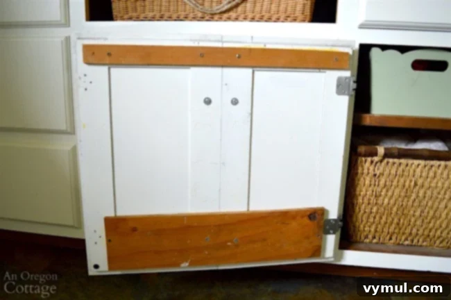 DIY Beadboard Faux Double Door Electrical Panel Cover 12 Mudroom Makeover: Another view of the cabinet's faux double door, showcasing its seamless integration into the mudroom design.