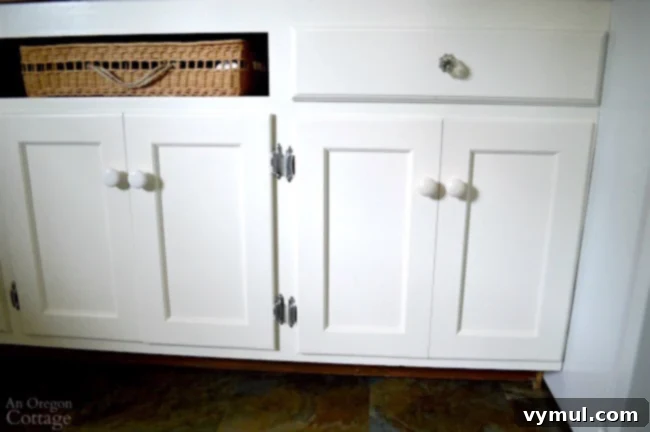 DIY Beadboard Faux Double Door Electrical Panel Cover 13 Mudroom Makeover: Finished look of the upcycled cabinet with its innovative faux double door solution, showcasing functionality.
