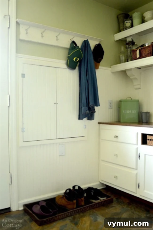 DIY Beadboard Faux Double Door Electrical Panel Cover 6 Mudroom Makeover: After image of the beadboard electrical panel cover, beautifully concealing the electrical panel and enhancing room decor.