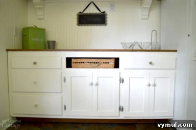 DIY Beadboard Faux Double Door Electrical Panel Cover 9 Mudroom Makeover: After shot of the renovated mudroom, featuring the stylish upcycled cabinets with a seamless look.