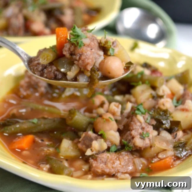 Slow Cooker Italian Sausage Vegetable Soup on spoon