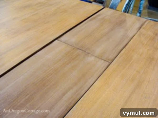 second sanding of table top-step4: The dining table top undergoing its second sanding with finer grit sandpaper, creating an ultra-smooth surface.