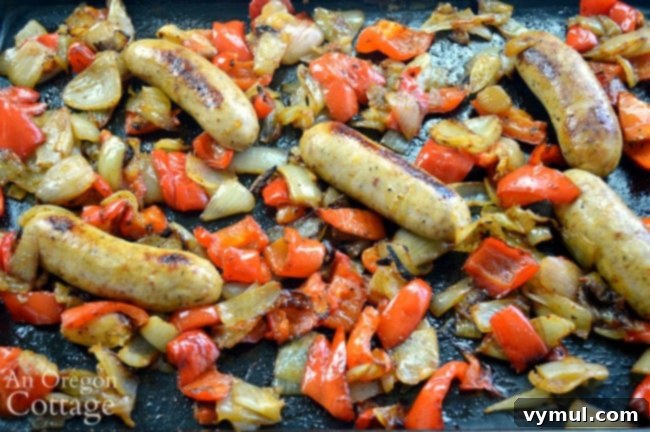 Sheet Pan Sausage & Veggies 6 Sheet pan dinner of roasted sausages, peppers, and onions, perfectly browned and cooked, fresh out of the oven