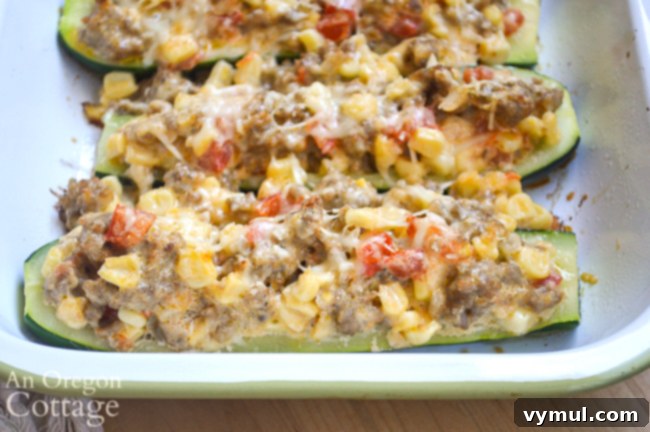 Savory Sausage and Corn Zucchini Boats 3 stuffed zucchini close