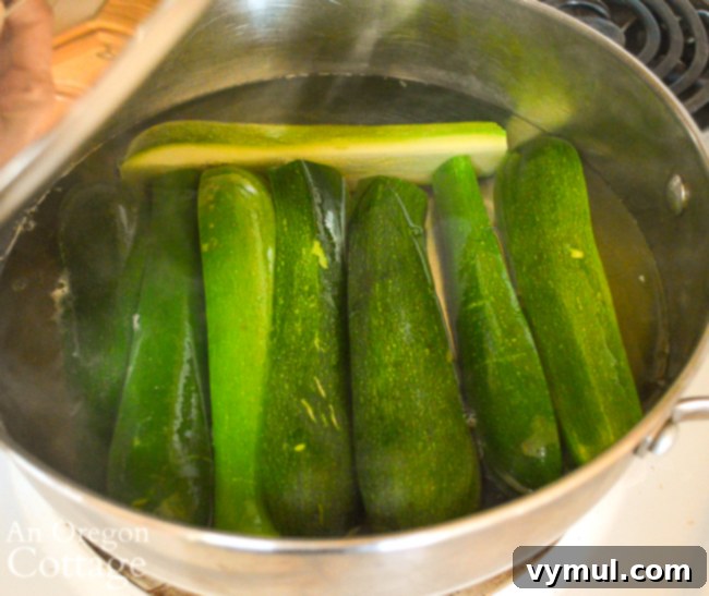 Savory Sausage and Corn Zucchini Boats 5 steaming zucchini in pot