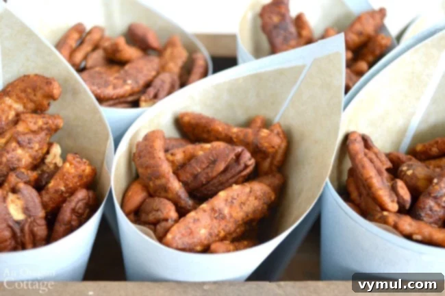 Sweet & Spicy Sriracha Nuts 4 Sriracha-Honey Nut Mix elegantly presented in paper cones, ready for serving