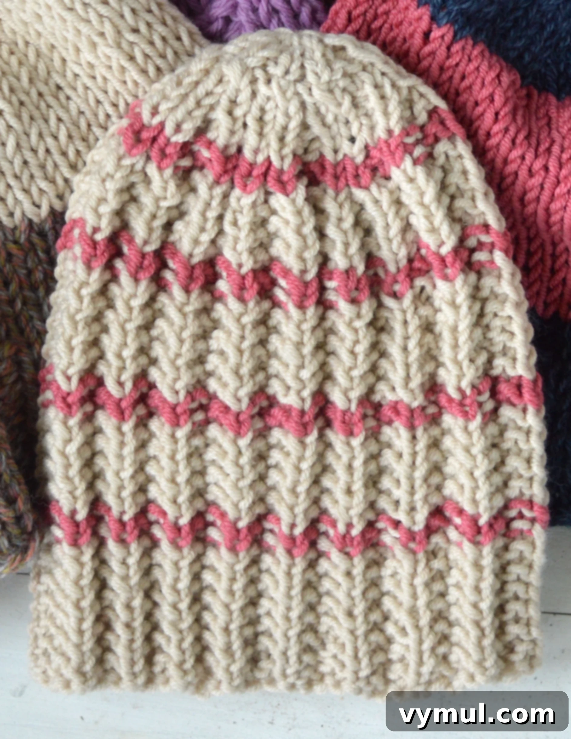 Yarn Stash Rescue Two Free Knit Hat Patterns 4 striped ribbed knitted hat in cream and pink
