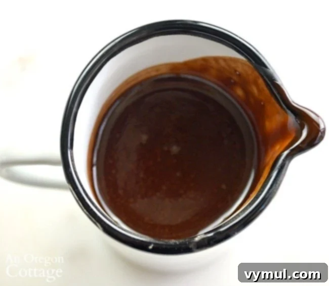 Crafting Your Own Pantry Staples 3 Homemade Chocolate Syrup in pitcher, a simple and healthier alternative to store-bought syrup