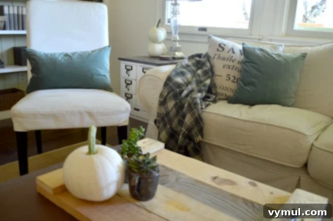 Autumnal Simplicity in Green and White 4 Inviting Simple Fall Decor featuring moss green accents and classic white pumpkins, creating a chic and earthy autumn display.
