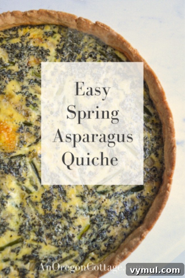 An appetizing whole spring asparagus quiche with a golden, flaky crust, perfect for a light and healthy meal.