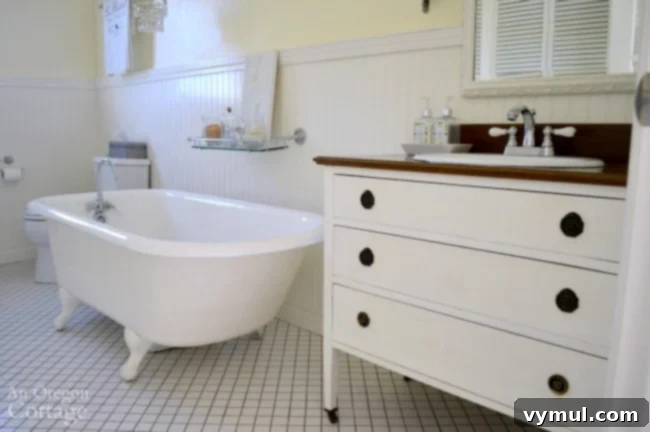 Upcycle a Dresser into a Beautiful Vanity 12 Dresser into a vanity with clawfoot tub in a rustic bathroom