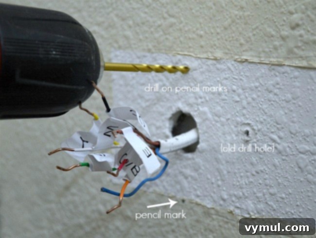 Mounting the new Wi-Fi smart thermostat backplate to the wall, ensuring it's level and secure