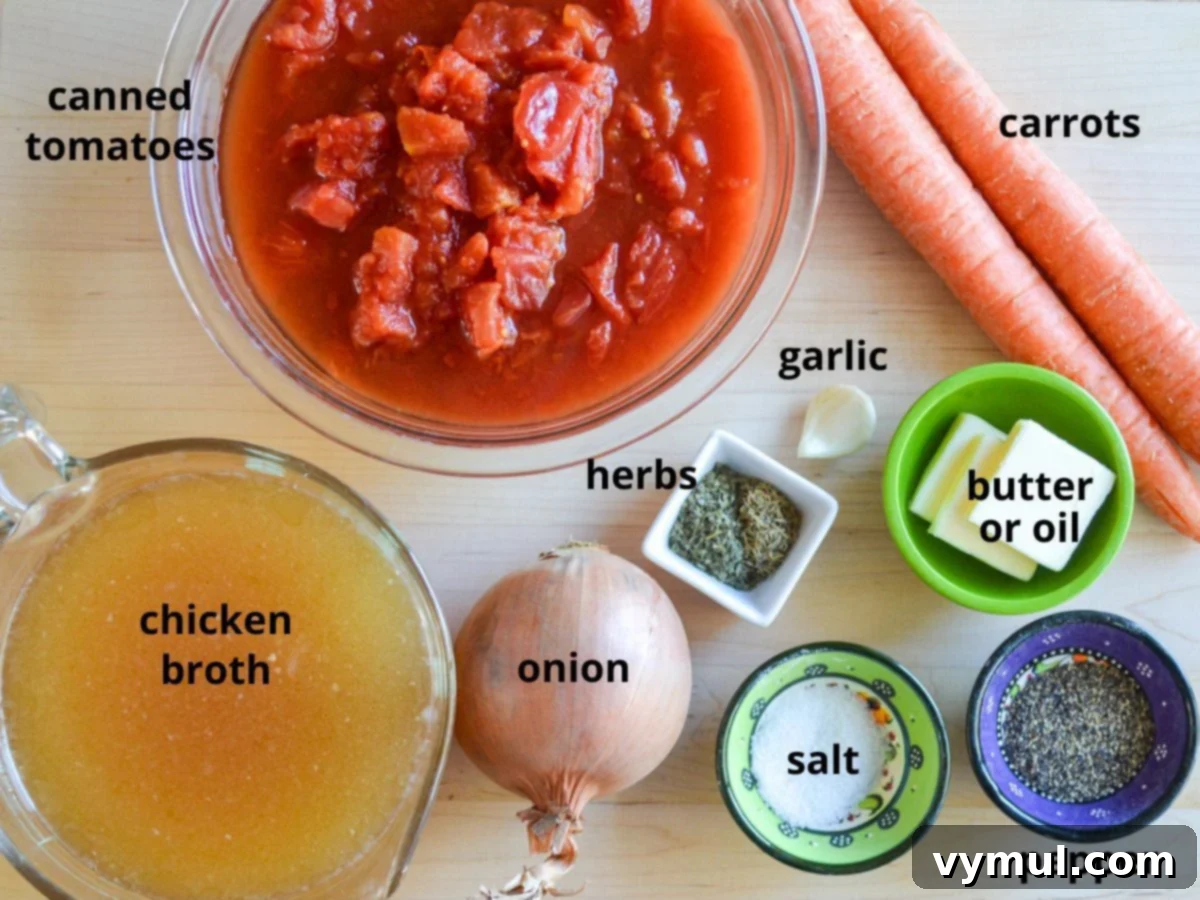 Homemade Tomato Soup Perfection: Say Goodbye To Canned Forever 4 A collection of fresh, vibrant ingredients including tomatoes, carrots, onion, garlic, and herbs, laid out for homemade tomato soup.