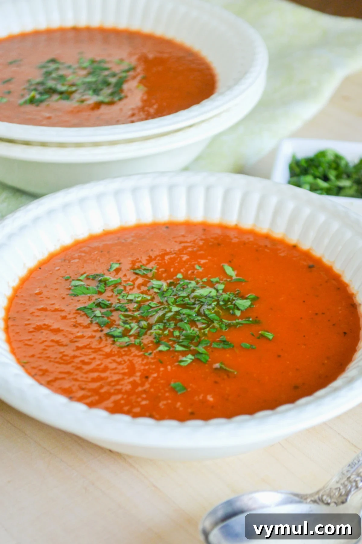 Homemade Tomato Soup Perfection: Say Goodbye To Canned Forever 6 Two white bowls of steaming homemade tomato soup, ready to be served and enjoyed.