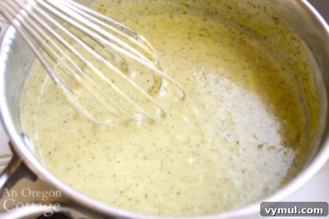 Creamy Pesto Pasta sauce with pesto in pot