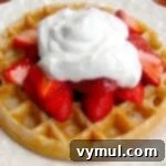 Irresistible Whole Wheat Sourdough Waffles 6 Fluffy Sourdough Waffles with strawberries and whipped cream