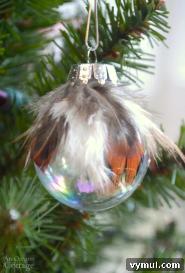 Effortless Feather & Glass Christmas Ornament Craft 3 Close-up of simple & unique feather and ball Christmas Ornament DIY, demonstrating elegant simplicity.