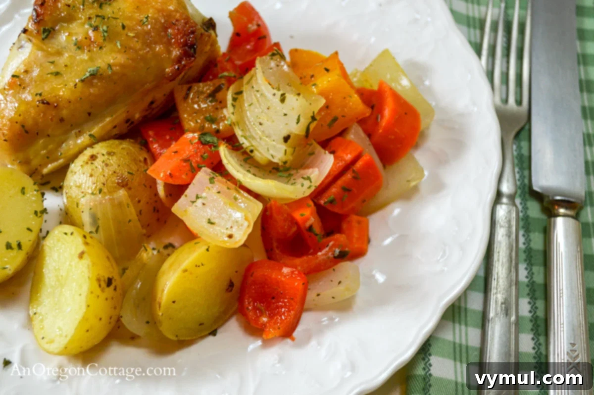 lemon roasted vegetables with chicken on plate close