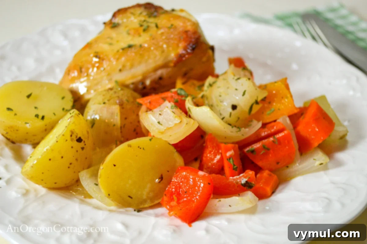 lemon roasted chicken and vegetables on white plate