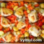 Sheet pan lemon roasted chicken and vegetables in pan above