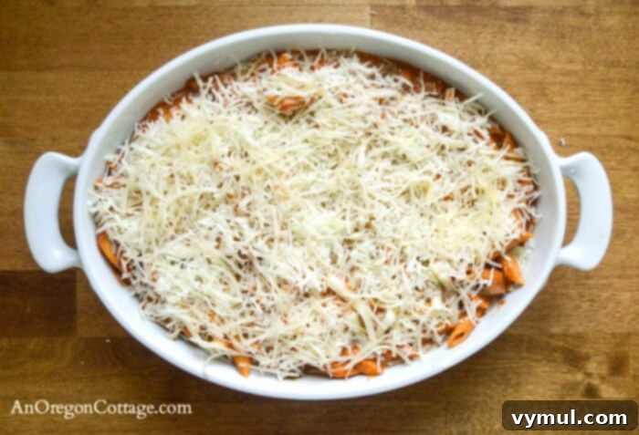 Second layer of cheese and pasta in baking dish