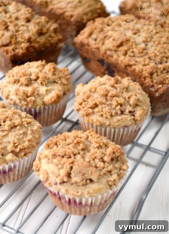 Golden Crumb Cranberry Wonders 6 Cranberry Crumb Loaves and Muffins cooling on a wire rack after baking