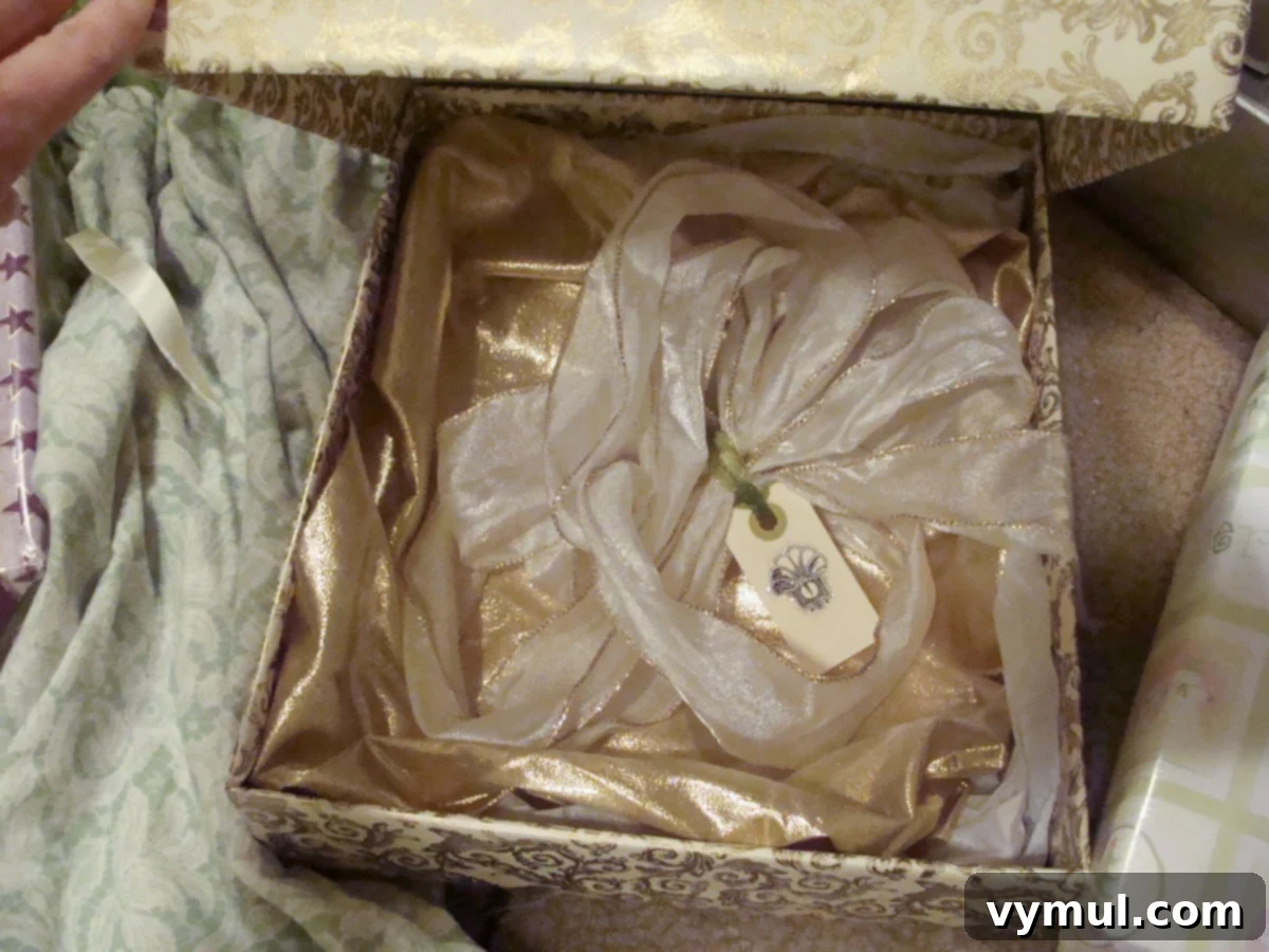 Effortless Christmas Gift Wrapping: Save Time, Save Money, Go Green 4 Beautiful gold wrapped Christmas present with bow and tissue stored inside for reuse