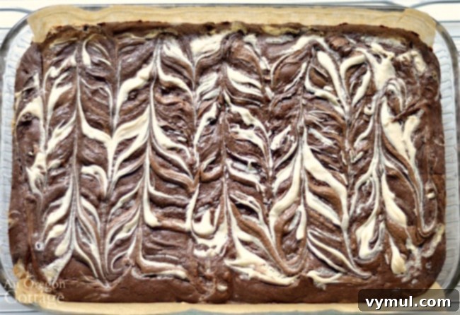 Quadruple chocolate decadent brownie baked with decorative top, showing the subtle pattern.