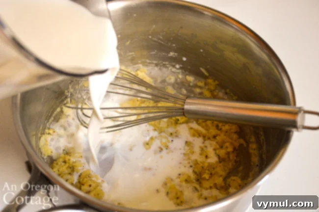 Velvety Broccoli Cauliflower Parmesan Bake 6 Whisking flour and spices into sautéed onions and garlic in a saucepan, forming a roux for the sauce