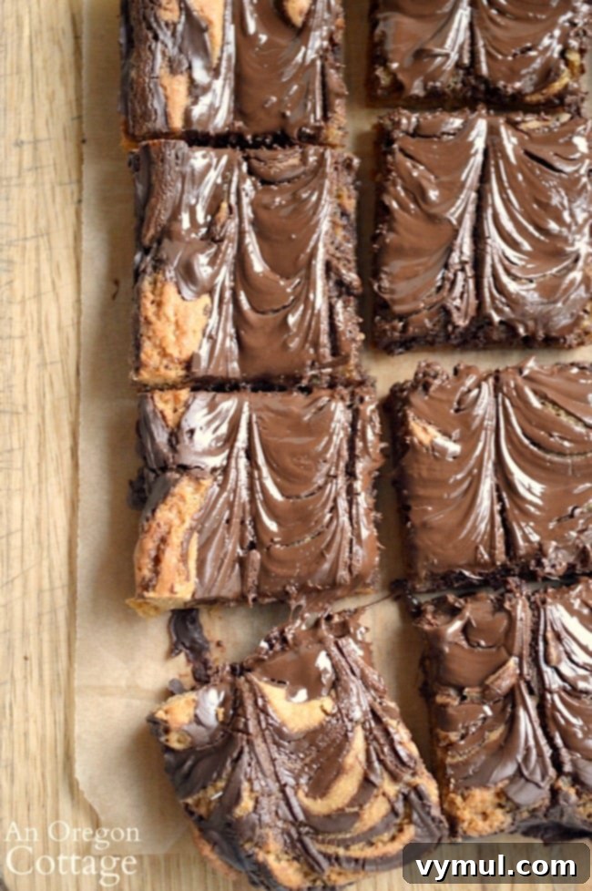 Chocolate Peanut Butter Swirl Bliss 8 Perfectly cut Classic Chocolate Peanut Butter Swirl Bars arranged on a cutting board, ready to serve