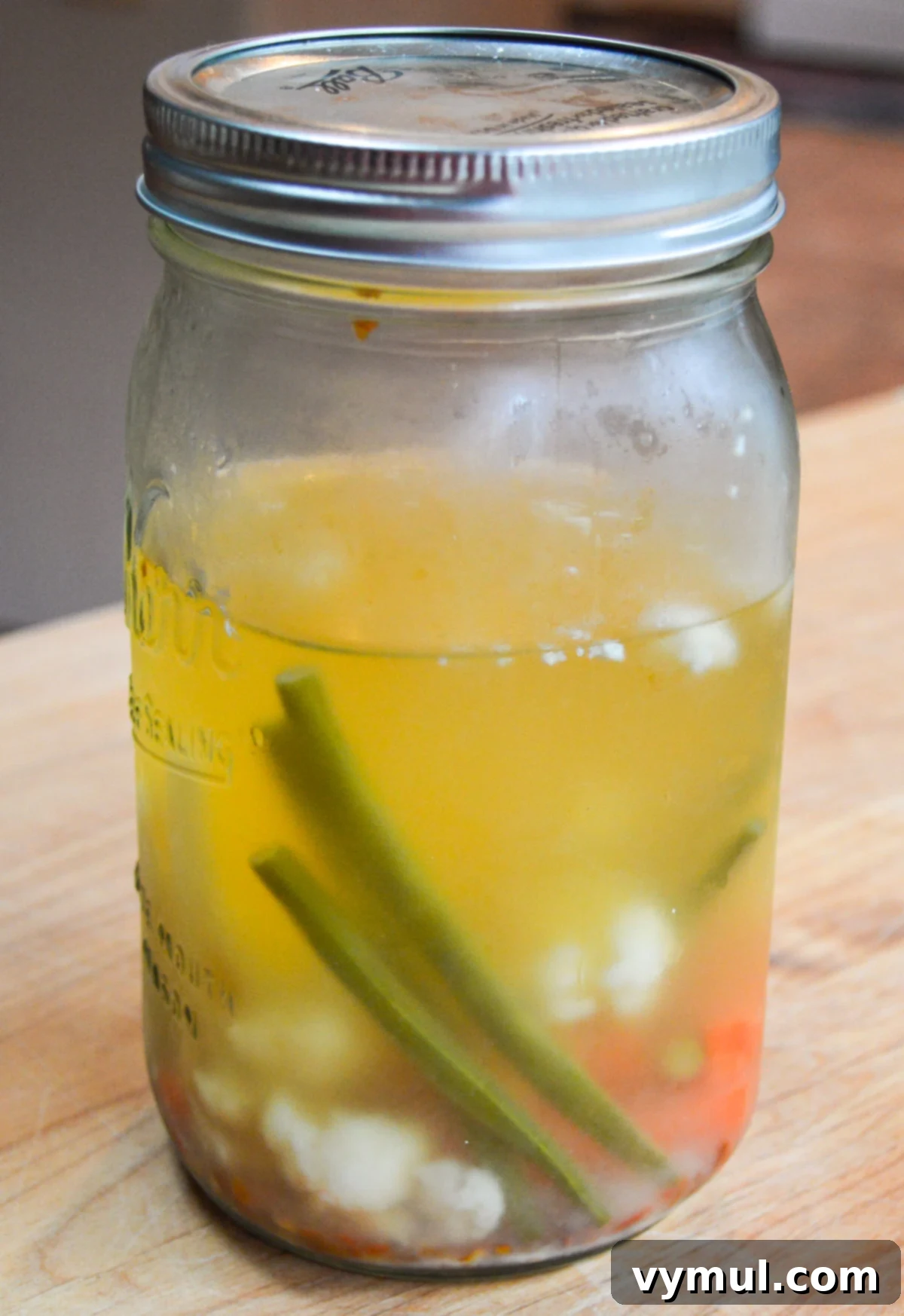 half full jar of fermented vegetables after refrigeration