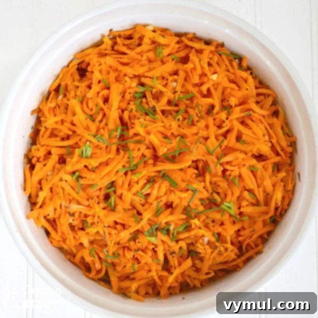 Tangy Lemon Garlic Baked Grated Carrots 3 Baked grated carrots served in a rustic bowl, ready to be enjoyed as a side dish.