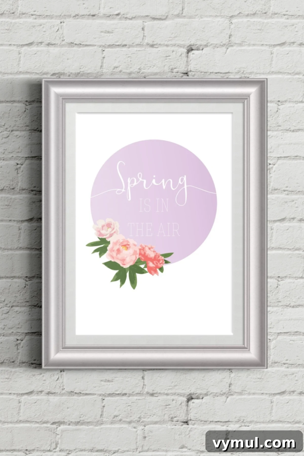 Framed 'Spring is in the Air' wall art on a rustic brick wall, showcasing beautiful floral design.