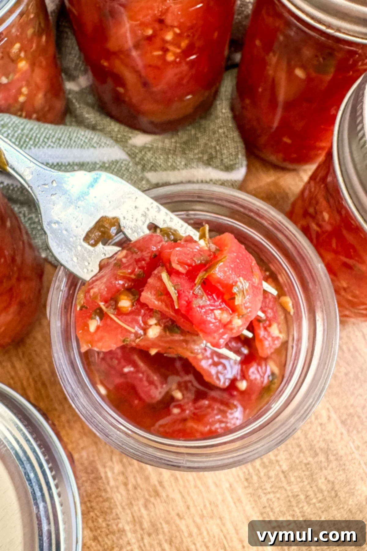 Easy Canned Tomato Bruschetta Summer Captured 12 canned tomatoes for bruschetta on fork