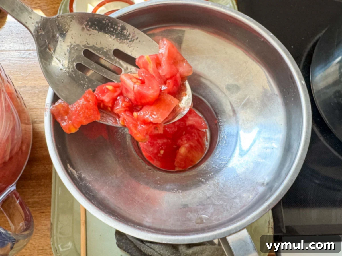 Easy Canned Tomato Bruschetta Summer Captured 5 adding chopped tomatoes to jar
