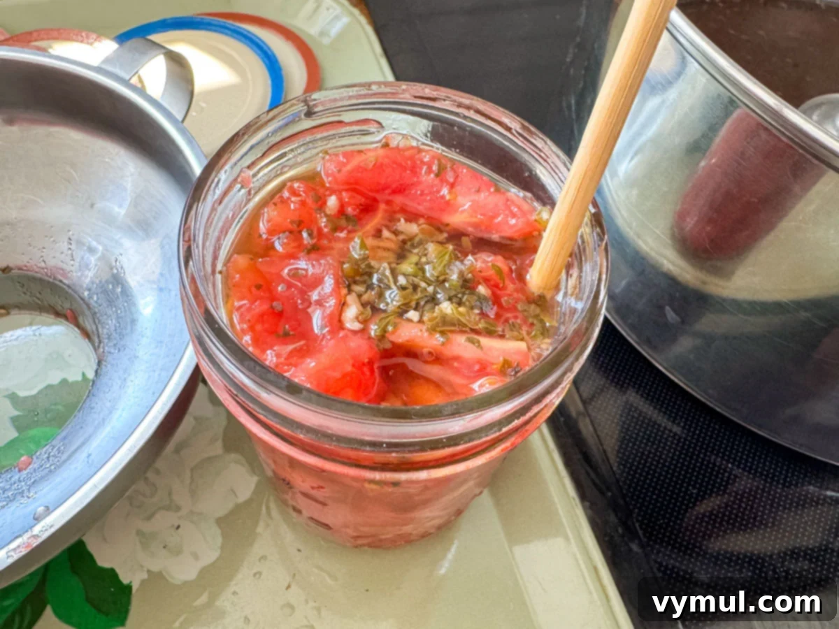 Easy Canned Tomato Bruschetta Summer Captured 7 removing air bubbles with a chopstick