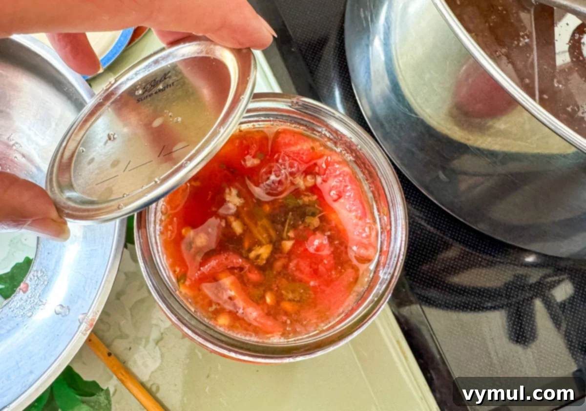 Easy Canned Tomato Bruschetta Summer Captured 8 attaching lid to canning jar